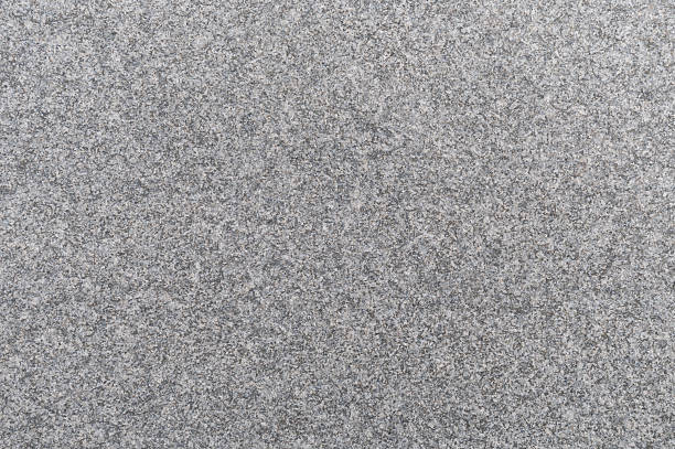 Fine gravel rock or pebble rock ground, top view. Background and texture.