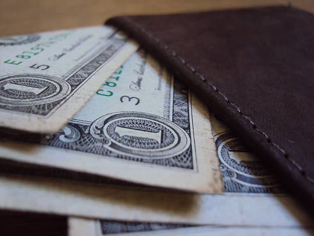 istock American dollar bills inside a leather wallet 2227680847
