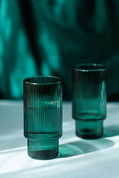 istock Dual Transparent Ribbed Glasses on White Table 2227682041