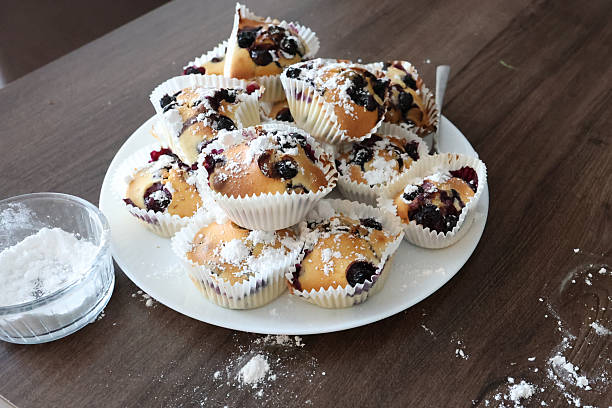 Single blueberry muffin on isolated white background