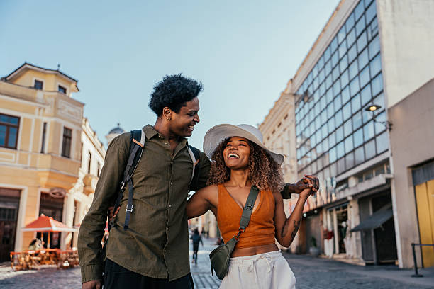istock Young tourist couple strolling through the city 2227683202