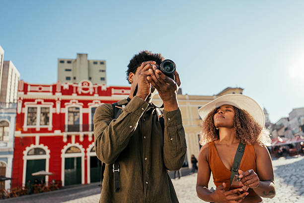 istock Tourist couple recording their trip with a camera 2227683424