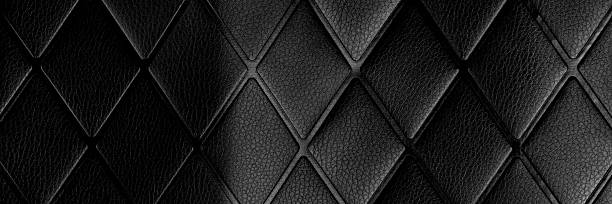 istock Black rhombic crumpled leather. Dark abstract surface 2227684654