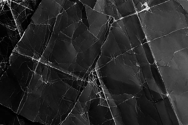 istock Torn pieces of black worn scuffed grunge cardboard. 2227684672