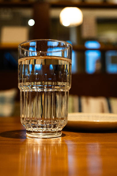 istock A glass and a plate on a table(vertical) 2227686650