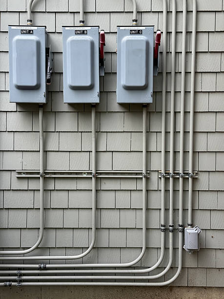 istock Electrical Conduit Wiring on Exterior on Building 2227689084