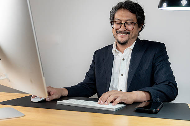 istock Happy Young Office Worker Working at Desk 2227692365