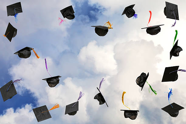 istock Graduation caps thrown in the sky 2227693625
