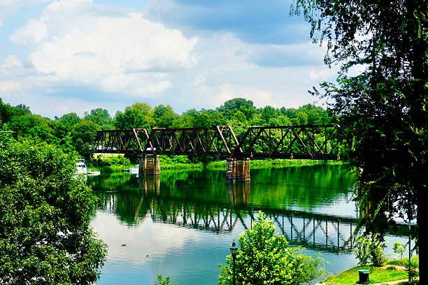 istock Reflections of a historic railroad bridge 2227695204