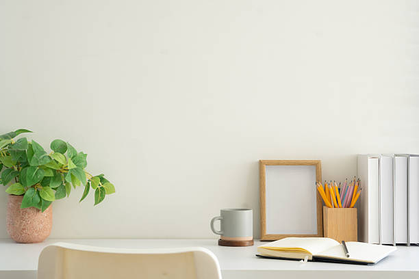istock Minimalist workspace with stationery, notebooks, coffee cup, and photo frame 2227695340