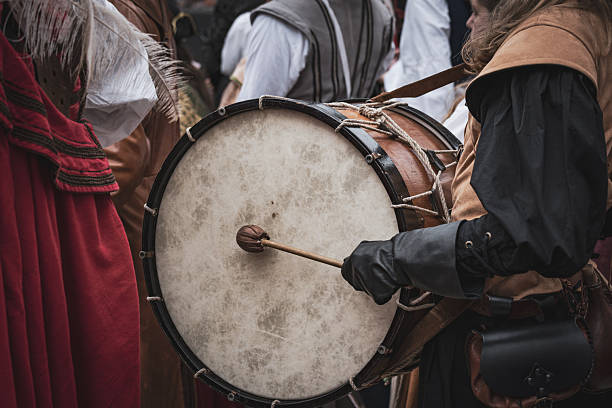 istock Medieval Drummer Holding Drum and Sticks 2227699300