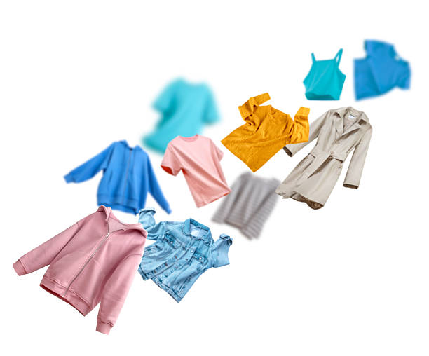Household, flying clean washed clothes set isolated on white. Fresh colorful apparel.