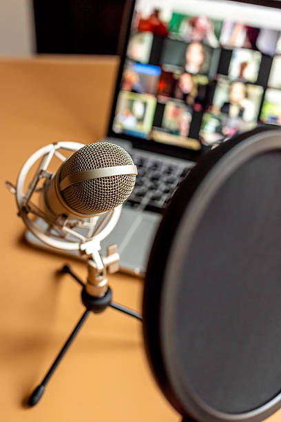 istock Home studio for podcast recording. Microphone and laptop on table 2227700964