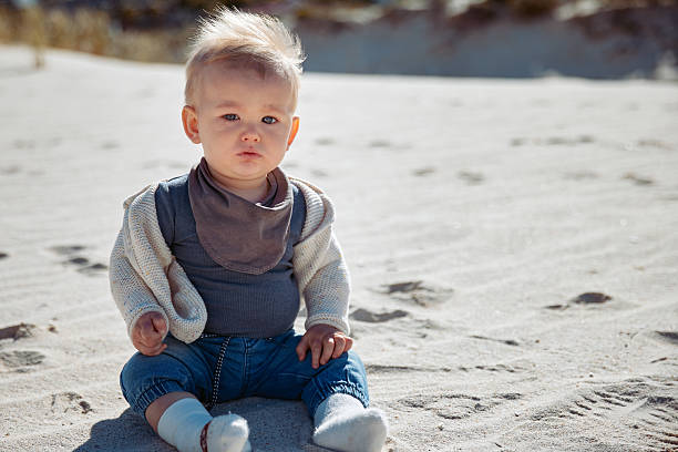 little girl is playing with waves on the beach. High quality photo