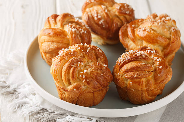 istock Yeast Knot Sugar Buns with Vanilla Close-up in Plate. Horizontal 2227705995