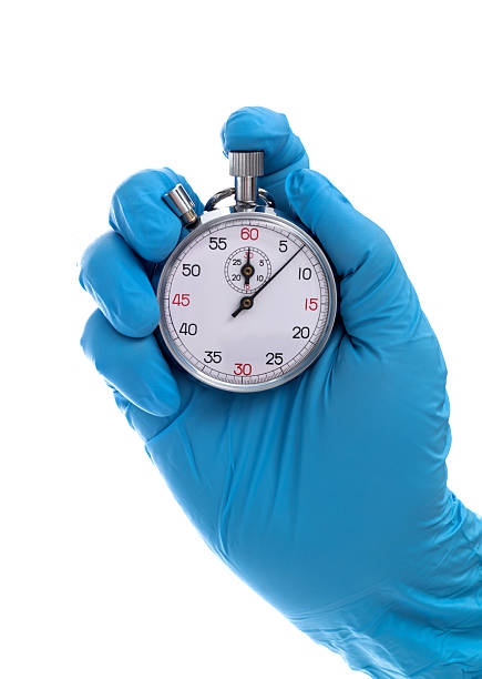 istock Doctor hand holding a stopwatch 2227706397