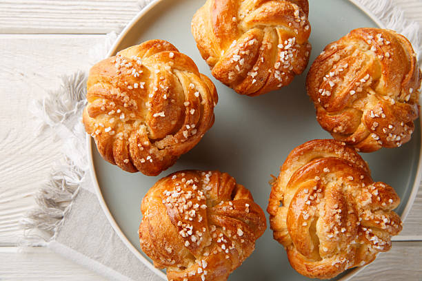 istock Homemade Knot sugar buns close-up in plate. horizontal top view 2227706413