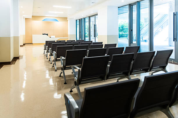 Hospital waiting room with many empty chairs
