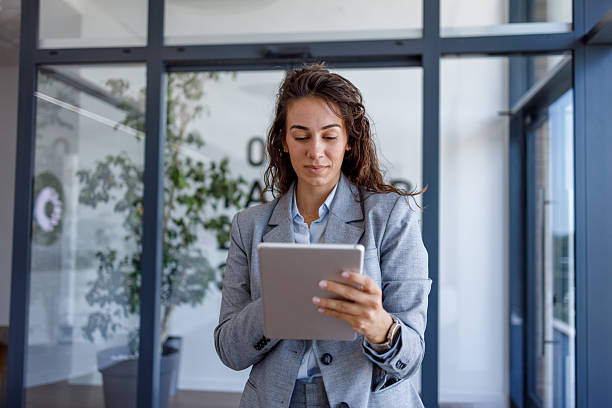 istock Businesswoman using digital tablet in modern office 2227707890