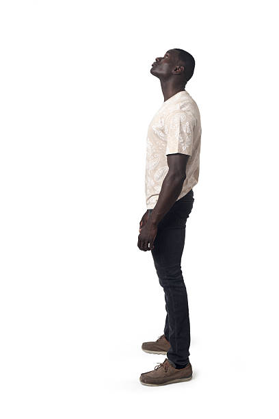 istock side view of a man standing and looking up on white background 2227712361