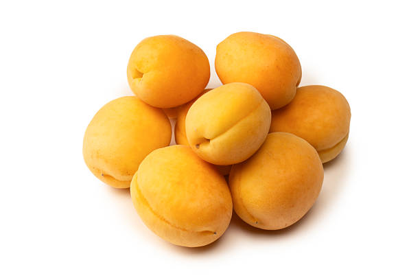 istock Ripe juicy orange apricots isolated on white background. 2227712451