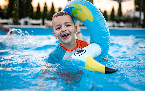 istock Mother and son enjoying the pool 2227712569