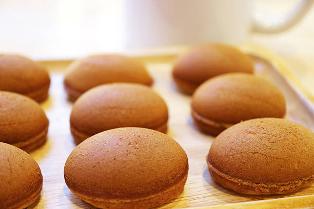Delectable Homemade Mini Coffee Cakes on a Wooden Breadboard