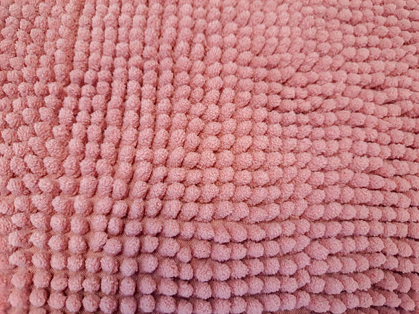 Close up on the surface of the polka dot rug.