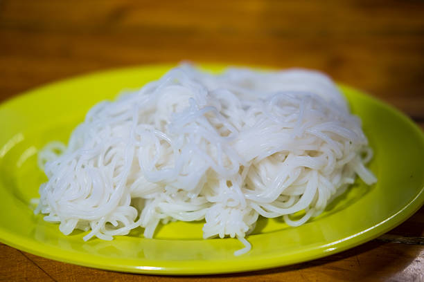 Thai vermicelli (Khanom Chin or slightly fermented noodles) served on a plate. The most popular menu is Kanom Jeen, Fish Curry with Vegetables or Spicy Khanom Jeen Salad.
