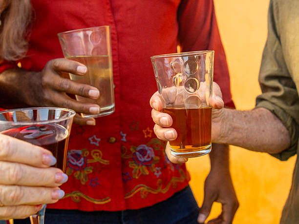 Diverse Adults Enjoy Different Beverages With Friends