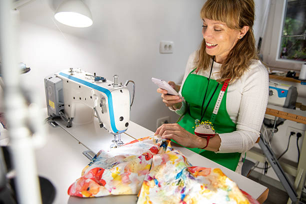 istock Seamstress taking pictures with smart phone 2227726586