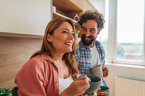 istock Happy couple enjoying breakfast together in modern kitchen 2227736211