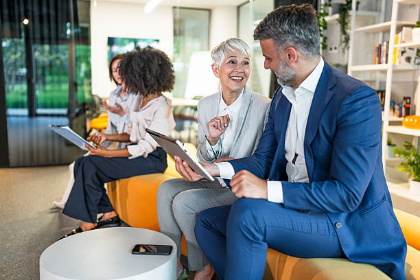 istock Smiling business people having a meeting in a modern office 2227737996