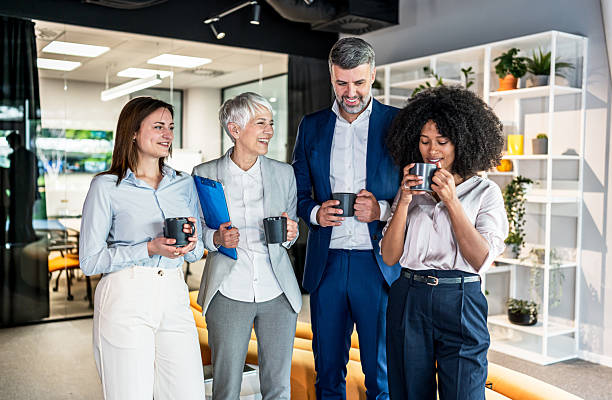 istock Cheerful business team enjoying coffee break in modern office 2227738158