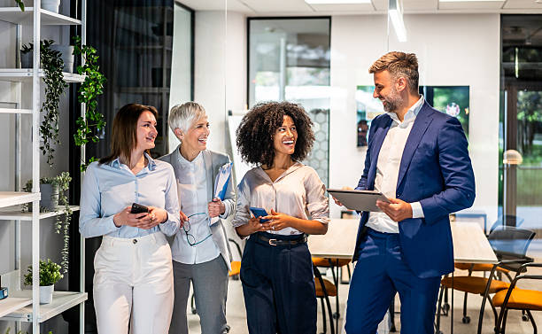 istock Business team walking and talking in modern office 2227738298