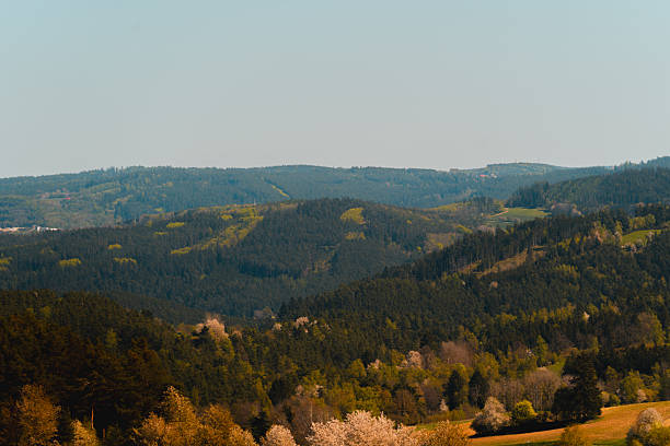 Tourism and travel concept image. Amazing silhouettes of mountains at a colorful sunset. View from Kulm Mountain, East Styria