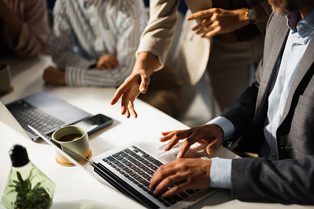istock Business team working together on laptop in modern office 2227739625