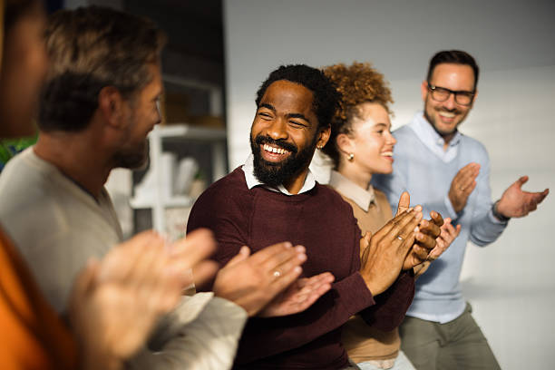 istock Business team clapping hands and celebrating success in the office 2227739700