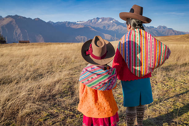 istock Peruvian woman crossing a field, Urubamba Valley 2227743166