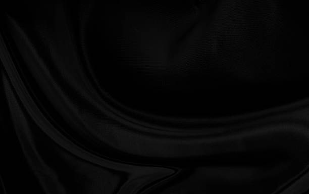 istock Black gray satin dark fabric texture luxurious shiny that is abstract silk cloth background with patterns soft waves blur beautiful. 2227746074
