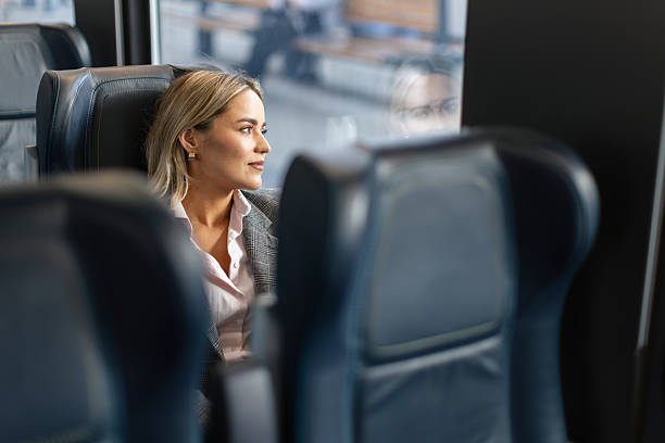 istock Business woman commuting to work on train 2227747038