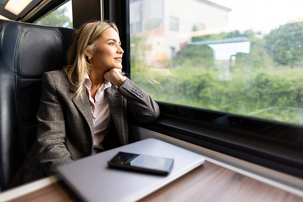 istock Business woman commuting to work on train 2227747173