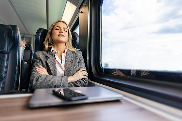 istock Business woman commuting to work on train 2227747273
