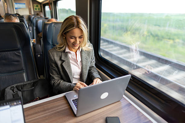 istock Business woman commuting to work on train 2227747343