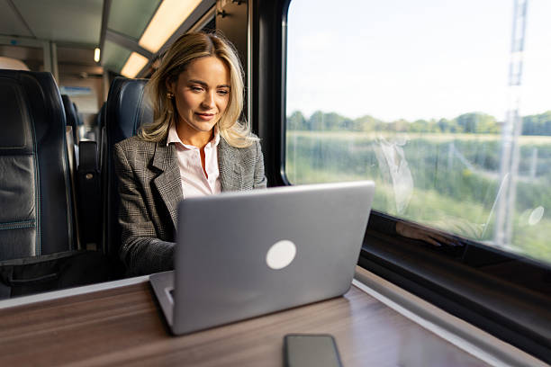 istock Business woman commuting to work on train 2227747365
