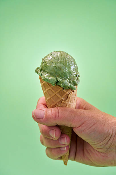 istock Pistachio Ice Cream in a  Cone 2227751639