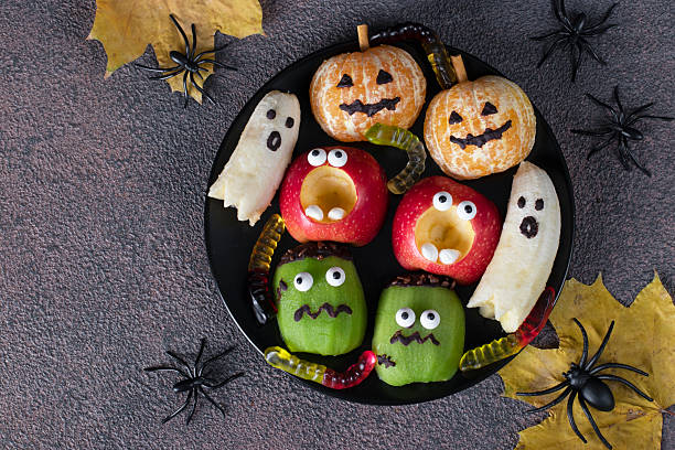 istock Fruit monsters and ghosts for Halloween party, Top view 2227758734