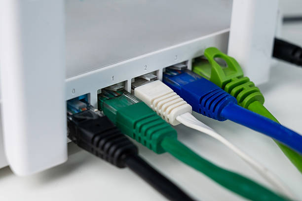 istock Colorful Ethernet Cables Connected to a Router. 2227759779