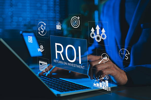 istock Analyzing ROI and Business Strategy Concepts. Businessman working on a laptop with various digital icons representing ROI, financial strategies, return on investment, and efficiency. marketing plan, 2227761179