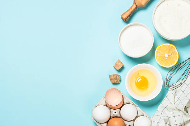 istock Baking background. Food cooking ingredients at blue table top view. 2227763847